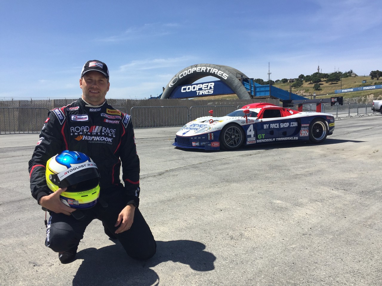 carl-rydquist-posing-with-race-car carl-rydquist-posing-with-race-car