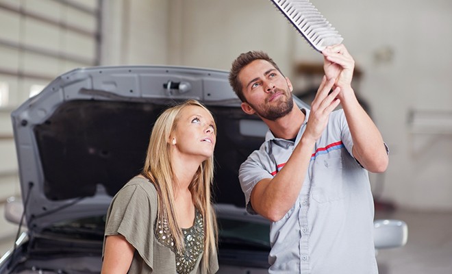 Mechanic-Showing-Customer-Dirty-Air-Filter Mechanic-Showing-Customer-Dirty-Air-Filter