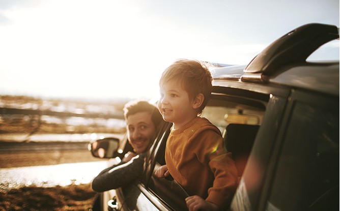 Man-and-Boy-Hanging-Out-of-Car-Windows Man-and-Boy-Hanging-Out-of-Car-Windows
