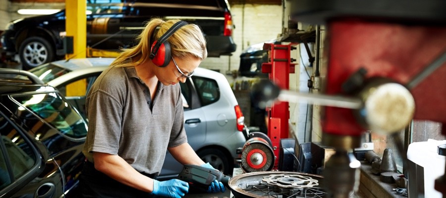 CHAM-Female-Mechanic-Servicing-Tire-Rim CHAM-Female-Mechanic-Servicing-Tire-Rim