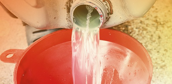 Pouring-Fluid-Into-Funnel Pouring-Fluid-Into-Funnel