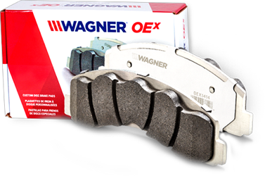 A Wagner OEx  brake pad displayed next to the products box