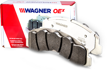 Wagner-OEX-Brake-Pads A Wagner OEx brake pad displayed next to the products box