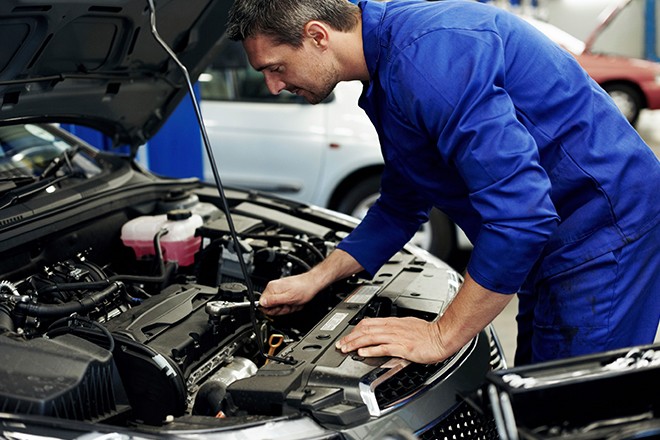 Mechanic-Examining-Car-Engine Mechanic-Examining-Car-Engine