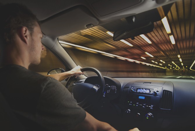 Man-Sitting-In-Driver-Seat-of-Car