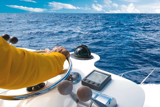 boat-steered-open-water Person navigating their boat in the open water.