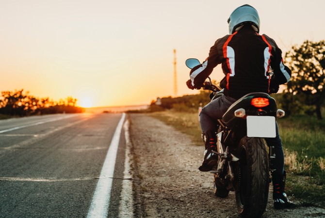 Motorcycle-Rider-On-Side-Of-Road